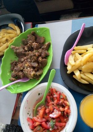 A picture of Boiled meat and pan fried potatoes with kachumbari.