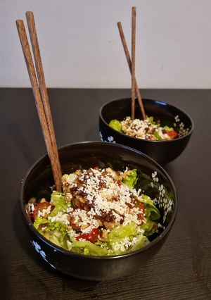 A picture of Green cheesy salad.