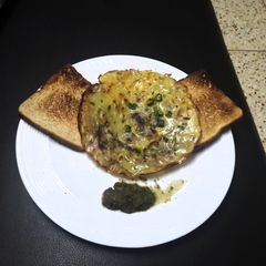 A picture of Besan ka.Pooda with toasted bread.