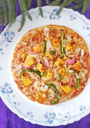 A picture of Cheesy Paneer Tikka Pizza.