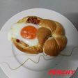 Huevos en nido de pan gratinado