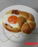 Huevos en nido de pan gratinado