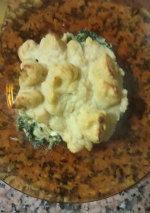 Foto de Empadão de bacalhau e espinafres como puré de grão