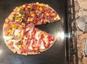Una foto de condimento para pizza