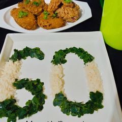 Coconut rice with steamed Moringa sauce and hot and spicy crispy chicken A picture of Coconut rice with steamed Moringa sauce and hot and spicy crispy chicken.