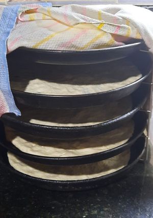 Una foto de Produccion de pizzas caseras