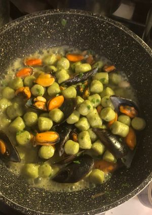 A picture of Potato Gnocchi with Seafood, Pesto, and Toasted Pine Nuts.