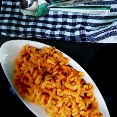 A picture of Indian style red sauce pasta.