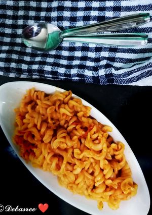 A picture of Indian style red sauce pasta.