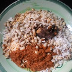 A picture of Rice and beans with stew.
