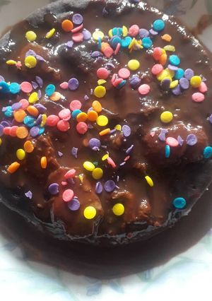 A picture of Chocolate cake with chocolate sauce.
