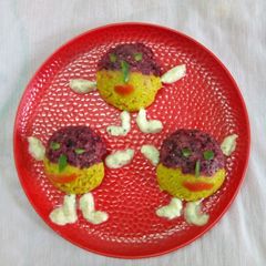 A picture of Two coloured daliya idli.