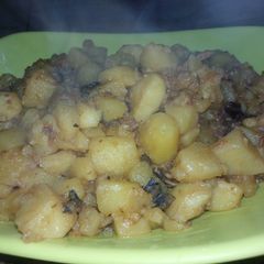 A picture of Potatoe Porridge with dried fish.