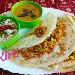 A picture of Paneer Corn Dosa with podi, Sambhar and Coconut chutney.