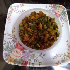 A picture of Lady's finger and pumpkin stir fry.