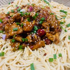 A picture of Orange Chicken with Aglio Olio pasta.