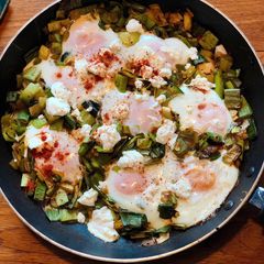 A picture of Baked eggs with spiced leeks and goats cheese.