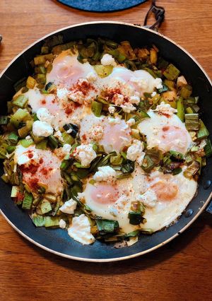A picture of Baked eggs with spiced leeks and goats cheese.