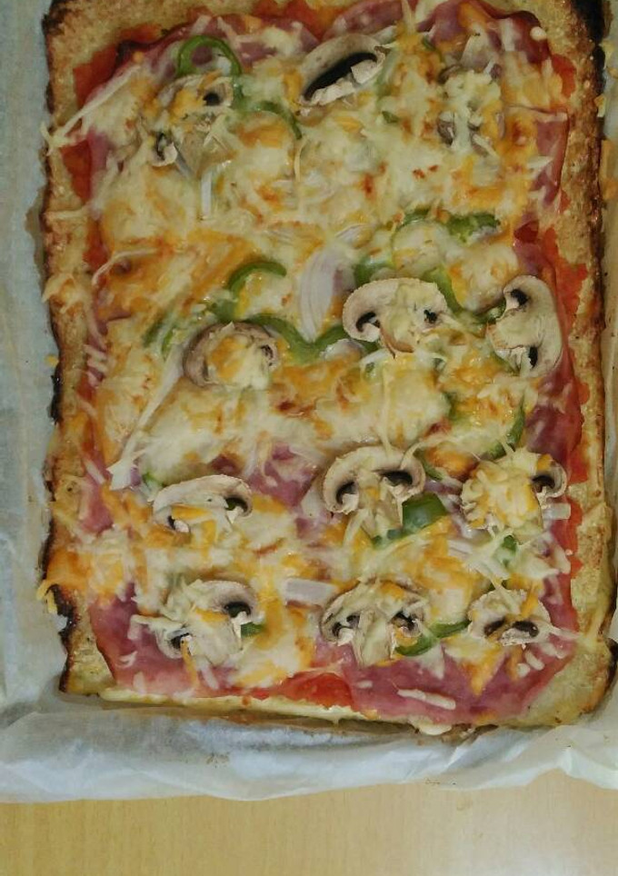 Una foto de Pizza con masa de coliflor