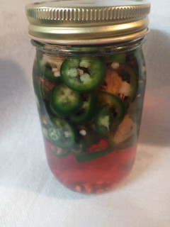 A picture of Fresh Pickled Jalapeno and Serrano Peppers.