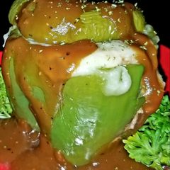 A picture of Mike's Stuffed Cheesy Meaty Bell Peppers With Gravy.
