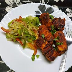 A picture of Grilled Tawa Fish With Sautéed Vegetables.