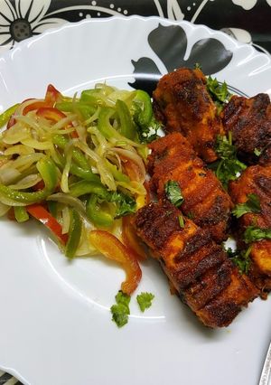 A picture of Grilled Tawa Fish With Sautéed Vegetables.