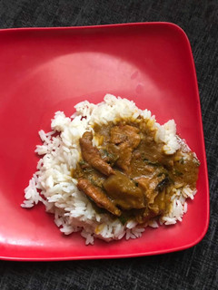 A picture of Ofe Akwu with white rice.