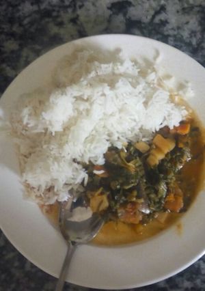 A picture of Beef stew with rice.