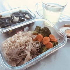 A picture of Beef vege bento and miso soup.