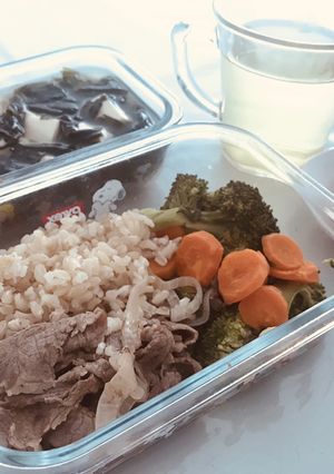 A picture of Beef vege bento and miso soup.