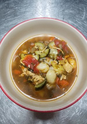 A picture of Chicken vegetable soup with gnocchi.