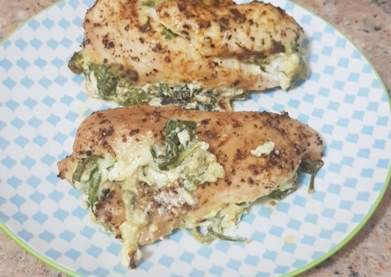 Baked chicken with cheesy spinach stuffing