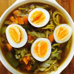 A picture of Veg Ramen noodles with eggs.