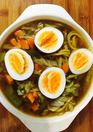A picture of Veg Ramen noodles with eggs.