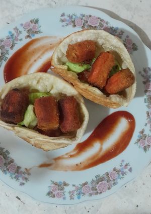 Una foto de Cestica de palmitos de cangrejo apanados
