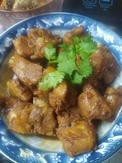 A picture of Honey-Glazed Pork Ribs in a Pan.