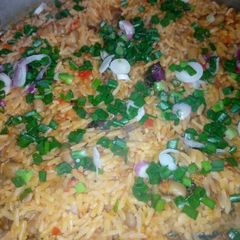 Jollof rice and beans with dry fish A picture of Jollof rice and beans with dry fish.