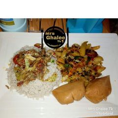 A picture of White rice with sauce,sultan chips and moimoi.