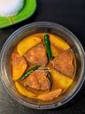 Katla Machcher jhol with potatoes.(Katla fish gravy with potatoes)