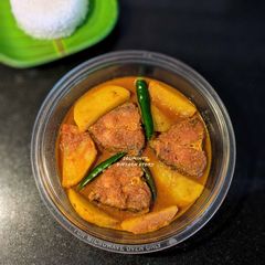 A picture of Katla Machcher jhol with potatoes.(Katla fish gravy with potatoes).