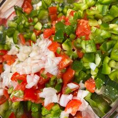A picture of Pico de gallo style salad.