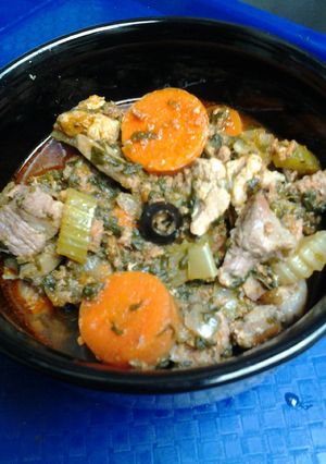 A picture of Slow simmered lamb, pork, chorizo, with vegetables.