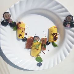 A picture of KHANDVI (stuffed with beetroot and coconut).