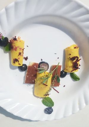 A picture of KHANDVI (stuffed with beetroot and coconut).