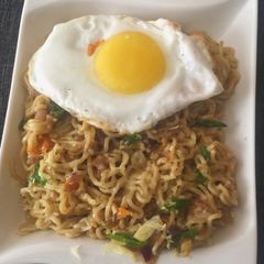 A picture of Mozzarella Cheese Noodles with Sunny Side up.