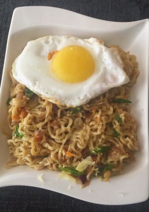 A picture of Mozzarella Cheese Noodles with Sunny Side up.