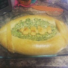 A picture of Spinach artichoke dip bread bowl.