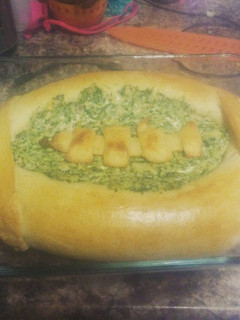 A picture of Spinach artichoke dip bread bowl.