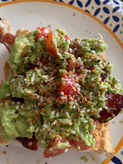 A picture of Avocado Egg in the Middle with Bacon.
